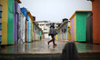 A Palestinian girl walks past temporary housing during a winter storm  in Beit Hanoun in t...