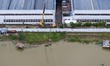 

Rescue workers are reinforcing electric poles by a river in Taizhou, Jiangsu province, C...