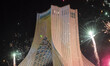 Fire works next to the Azadi (Freedom) monument in western Tehran during a rally commemora...