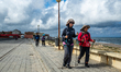 Asian pilgrims are seen walking the Portuguese Camino Coastal Route, on June 2023. 
