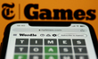 NYT Games logo on website displayed on a screen and Wordle game displayed on a phone scree...