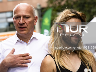 The governing Mayor of Berlin Kai Wegner (L) attends the 45th Christopher Street Day (CSD) Berlin Pride demonstration, in Berlin, Germany on...
