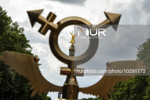 The Victory Column (Siegessaeule) is pictured through a queer symbol during the 45th Christopher Street Day (CSD) Berlin Pride demonstration...