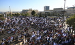 Israeli protesters attend a demonstration outside the Israeli parliament (Knesset) and the...
