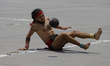 A pre-Hispanic ball player performs a demonstration in the Zocalo of Mexico City, during t...