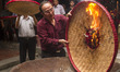 Worshipers starting burning the yellow papers as the symbol  to sending Deities brought by...