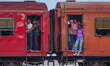 People go to work by train on July 28, 2023, in Colombo, Sri Lanka. 