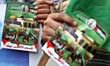 Palestinian Hamas supporters wave national flags while holding pictures of Sheik Raed Sala...