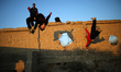 Palestinian youths from Gaza Parkour team, practice their Parkour skills in cemeteries in...