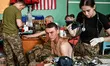ZAPORIZHZHIA REGION, UKRAINE - JULY 26, 2023 - A serviceman is given first aid at a stabil...