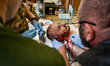 ZAPORIZHZHIA REGION, UKRAINE - JULY 26, 2023 - A wounded serviceman is given first aid at...