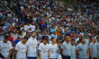 

The players and crowd in the stadium are observing a minute's silence for the murder of...