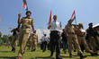 Indian policemen and school students march during a Tiranga Rally under 'Meri Maati Mera D...