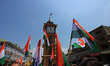 Indian policemen and school students carry Indian national flag during a Tiranga Rally und...