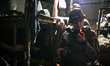 UKRAINE - AUGUST 11, 2023 - A serviceman lights a cigarette as the artillery unit of the 1...