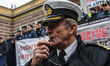 A demonstrating coast guard officer and his pipe