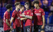 Joe Hugill #52 of Manchester United celebrate the win on penalties 3-5 during the EFL Trop...