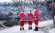 Members of the Red Cross are helping the residents of Mount Parnitha in Athens, Greece, on...