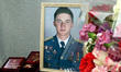 KHARKIV, UKRAINE - AUGUST 23, 2023 - Flowers and decorations lie at the portrait of perish...