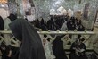 Shi'ite pilgrims at a holy shrine while taking part in a religious ceremony to commemorate...