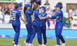 Lauren Filer of England celebrates with Amy Jones (wk) after getting the wicket of Kavisha...