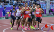 Runners compete in the men's 3000m steeplechase final athletics event during The 19th Asia...