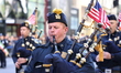 The Port Authority Police Marching Band performs while marching up 5th Avenue during the 7...