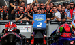 Maverick Vinales of Spain and Aprilia Racing celebrates his win with his team at the parc...