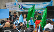 A Guatemalan migrant in the costume of the National Bird of Guatemala ''El Quetzal'' suppo...