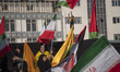 Iranian protesters wave Iran flags and a Palestinian flag during an anti-Israel rally in T...
