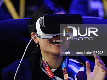 A woman reacts as she uses a new Samsung Gear 360 Vr , during the second day of Mobile World Congress 2016 in Barcelona, 23rd of February, 2...