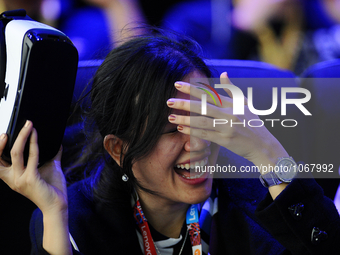 A woman reacts after she used a new Samsung Gear 360 Vr , during the second day of Mobile World Congress 2016 in Barcelona, 23rd of February...