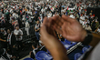 A pro-Palestinian demonstrators praying during a peaceful rally at the Bukit Jalil indoor...