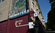 ZAPORIZHZHIA, UKRAINE - OCTOBER 23, 2023 - Project curator Liona Radchenko presents a mura...