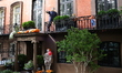 Creepy Halloween characters from terror films cover the doorway and the exterior of a Gram...