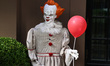 Creepy Halloween characters from terror films cover the doorway and the exterior of a Gram...