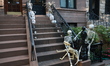 Skeletons of humans and dogs cover the exterior of a townhouse in New York, New York, Thur...