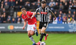 Kyle Cameron of Notts County under pressure from Sam Dalby of Wrexham during the Sky Bet L...