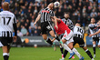 Matt Palmer of Notts County heads the ball under pressure from Sam Dalby of Wrexham during...