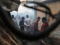 Traders are arriving to inspect their losses following a fire that broke out in Baburhat, Narsingdi, Bangladesh, on October 30, 2023. They a...