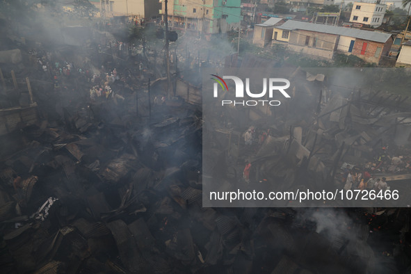 Traders are arriving to assess their losses after a fire broke out in Baburhat, Narsingdi, Bangladesh, on October 30, 2023. The location is...