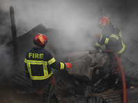 Fire service personnel from Bangladesh are currently extinguishing a fire that erupted in Baburhat, Narsingdi, Bangladesh, on October 30, 20...