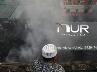 Smoke is billowing from a fire that is currently raging at one of the largest textile wholesale markets in Baburhat, Narsingdi, Bangladesh,...