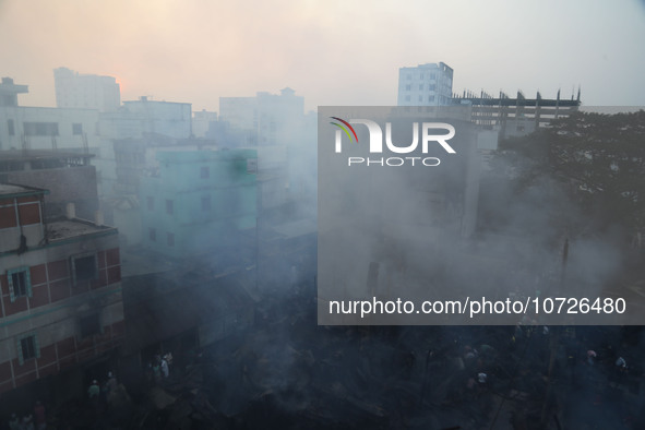 Smoke is billowing out as a fire is breaking out at one of the largest textile wholesale markets in Baburhat, Narsingdi, Bangladesh, on Octo...