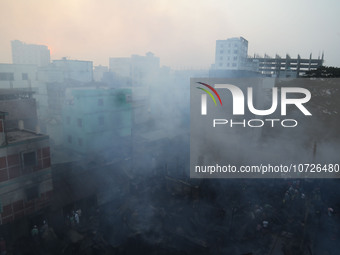 Smoke is billowing out as a fire is breaking out at one of the largest textile wholesale markets in Baburhat, Narsingdi, Bangladesh, on Octo...