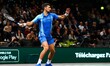 Novak Djokovic returns the ball to Holger Rune during their men's singles quarter-final ma...