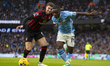 Jeremy Doku #11 of Manchester City goes past the opponent during the Premier League match...