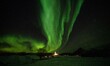 Northern Lights are seen reflected in the sky over the town of Lofoten, Norway. November 0...