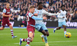 Moussa Niakhate of Nottingham Forest shields the ball from Jarrod Bowen of West Ham United...