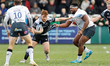 Rory Jennings of Newcastle Falcons  is caught by Eroni Mawi of Saracens during the Gallagh...